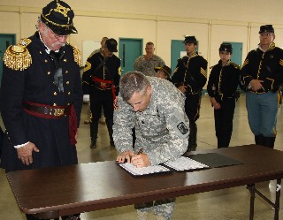 Lt Col Holan signs Proclamation
